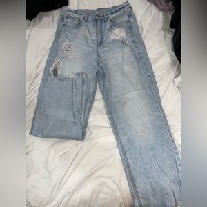 American Eagle,light wash mom blue jeans,rips towards the top and frayed bottoms